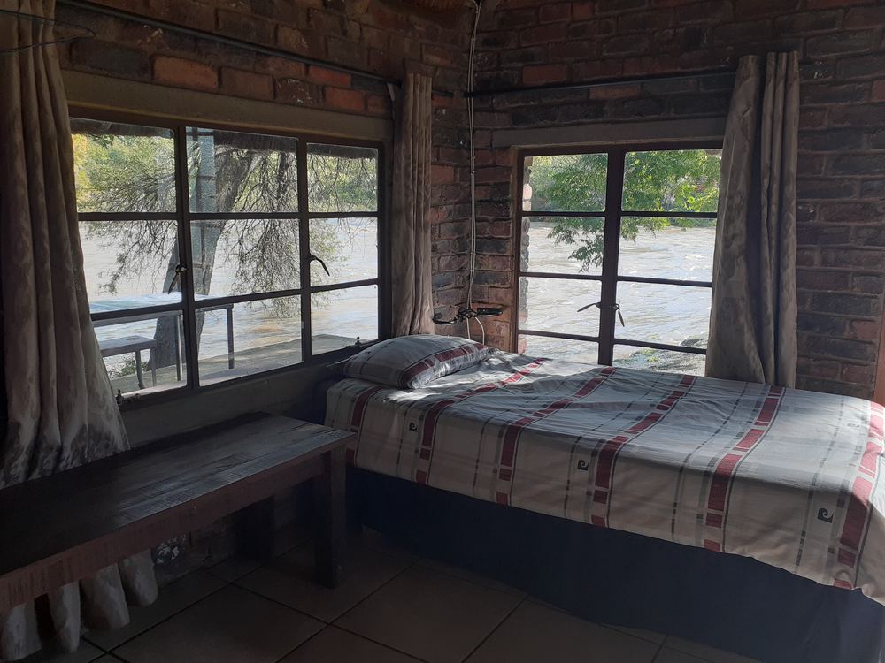 Chalet bedroom with large windows
